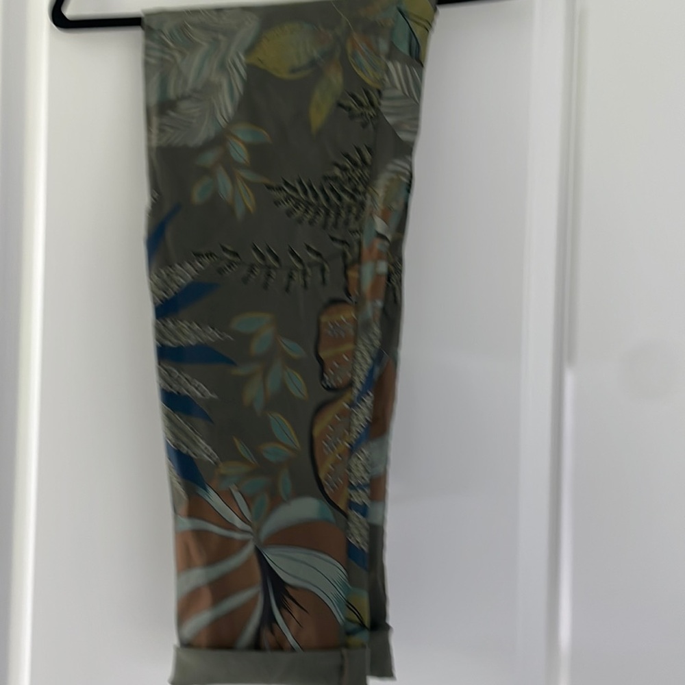Plenty of stretch in these adorable pants. Tie at waist and you can roll cuffs.